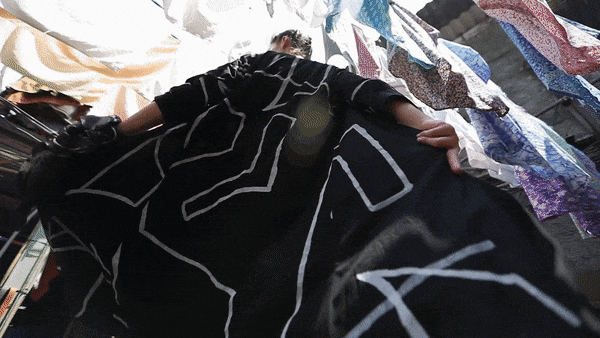 Long jacket with a symbol - black