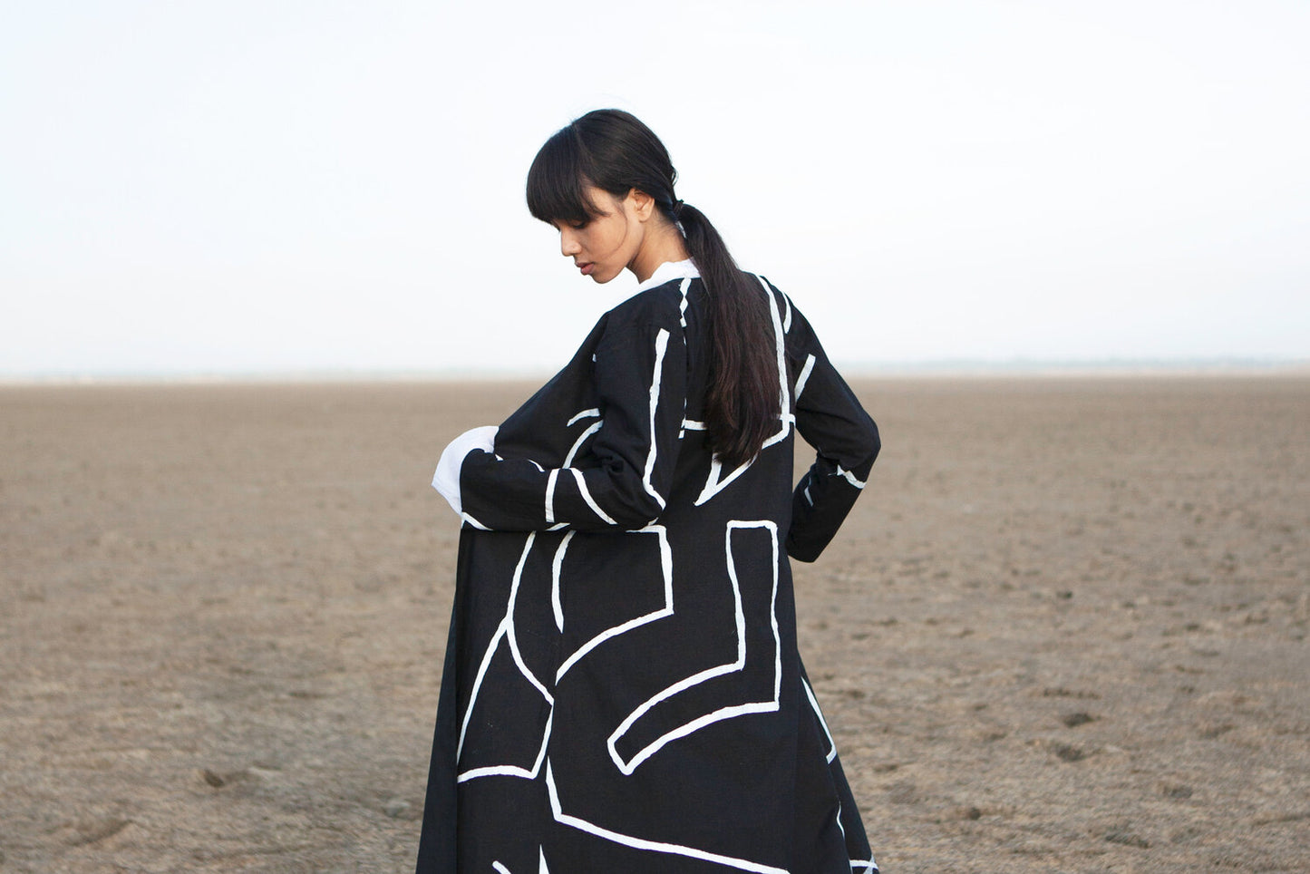Long jacket with a symbol - black
